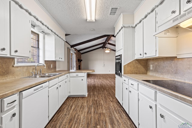 kitchen featuring visible vents, oven, white dishwasher, under cabinet range hood, and a sink