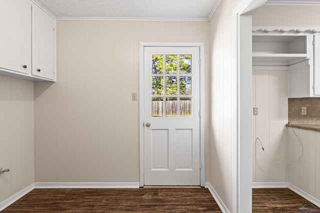 laundry room with dark wood-style floors and baseboards