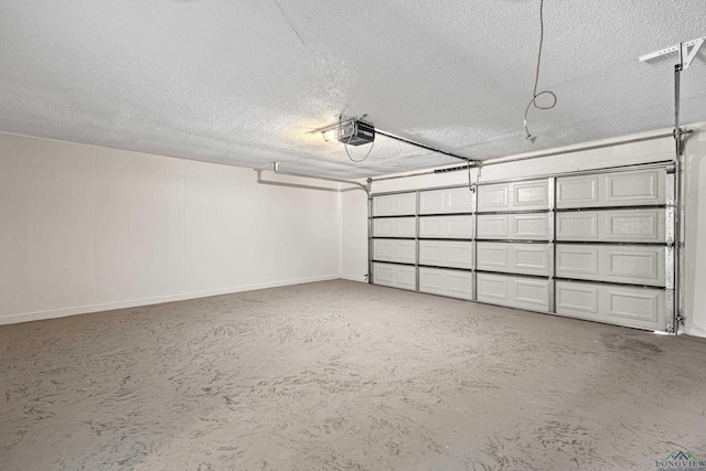 garage with baseboards and a garage door opener