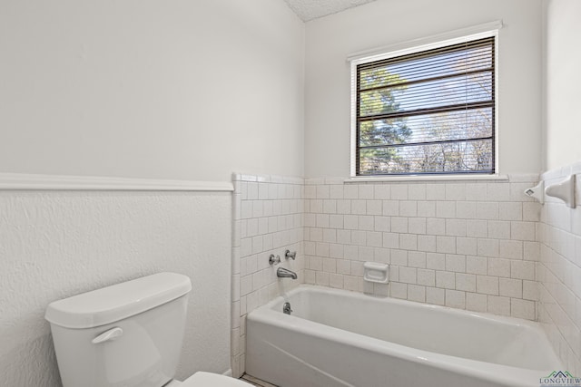 full bath with a tub to relax in and toilet