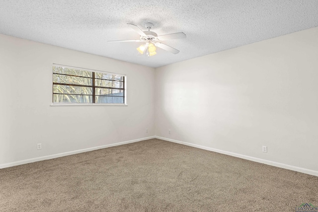 carpeted empty room with ceiling fan, baseboards, and a textured ceiling