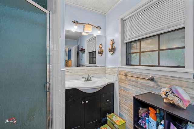 bathroom with crown molding, wood walls, an enclosed shower, and a textured ceiling