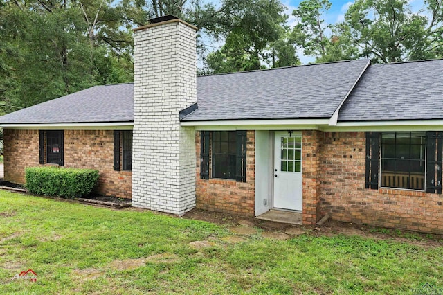 ranch-style house with a front lawn