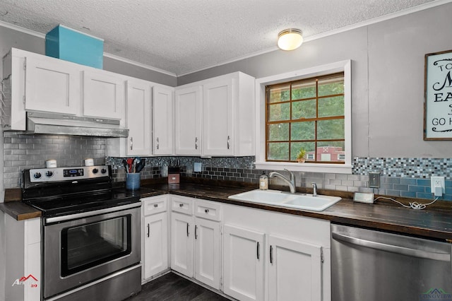 kitchen featuring sink, white cabinets, stainless steel appliances, and a textured ceiling