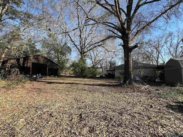 18335 Fm 1716 E, Tatum, TX 75691 - view of yard with an outdoor structure