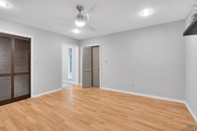 unfurnished bedroom featuring ceiling fan and light hardwood / wood-style flooring