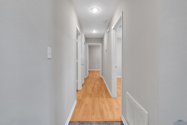 hall with light wood-type flooring