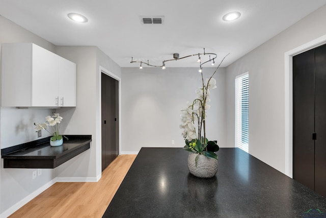 dining space with light hardwood / wood-style flooring