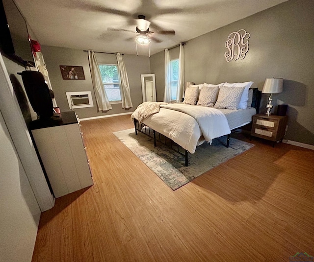 bedroom with hardwood / wood-style flooring and ceiling fan