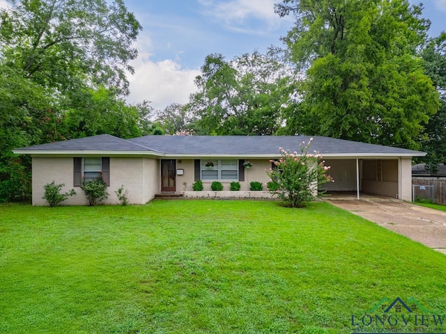 ranch-style home featuring a carport and a front yard