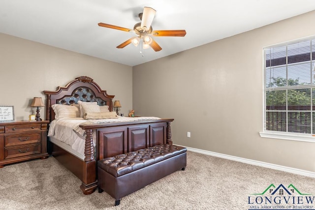 carpeted bedroom featuring baseboards and ceiling fan