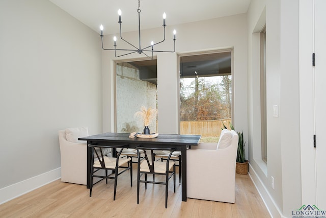 dining space with a wealth of natural light and light hardwood / wood-style floors