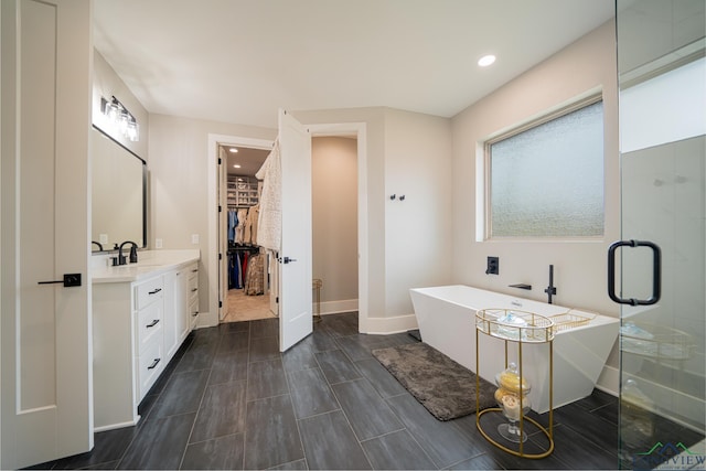 bathroom featuring vanity and plus walk in shower