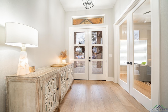 doorway featuring light hardwood / wood-style flooring and french doors