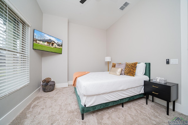 bedroom with ceiling fan and carpet