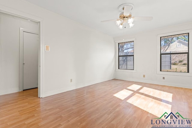 unfurnished room featuring a wealth of natural light and light wood finished floors