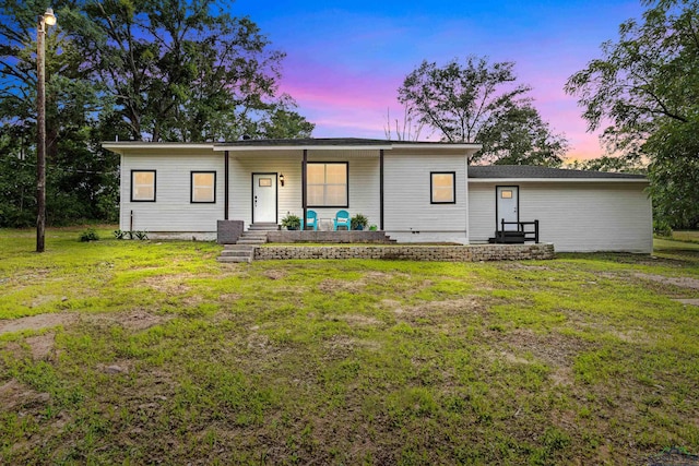 view of front of property with a lawn