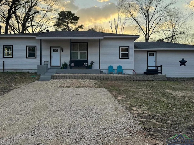 view of front of property featuring covered porch