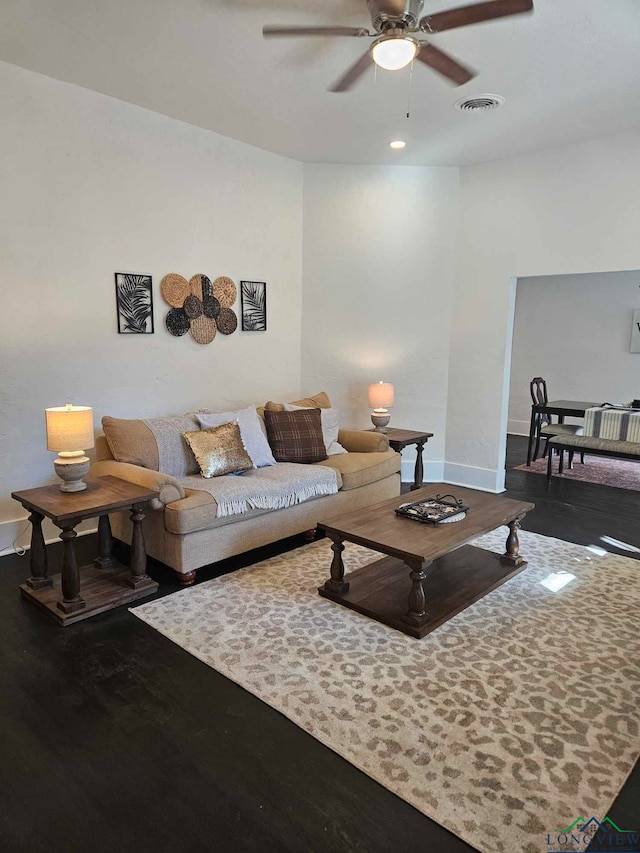 living room with hardwood / wood-style flooring and ceiling fan