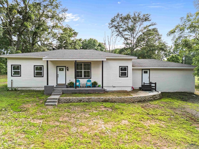 ranch-style home with a front yard