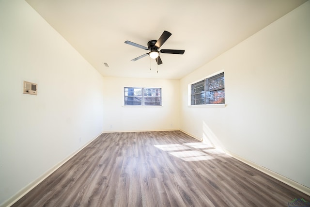 unfurnished room featuring ceiling fan and hardwood / wood-style floors