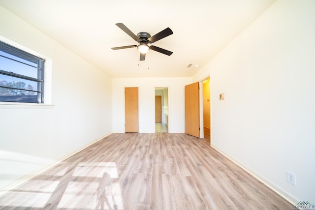 unfurnished room featuring ceiling fan and light hardwood / wood-style floors