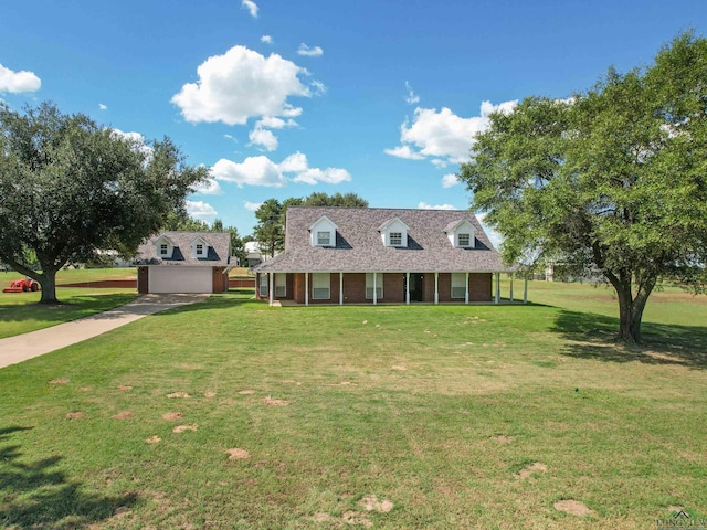 cape cod house with a front lawn