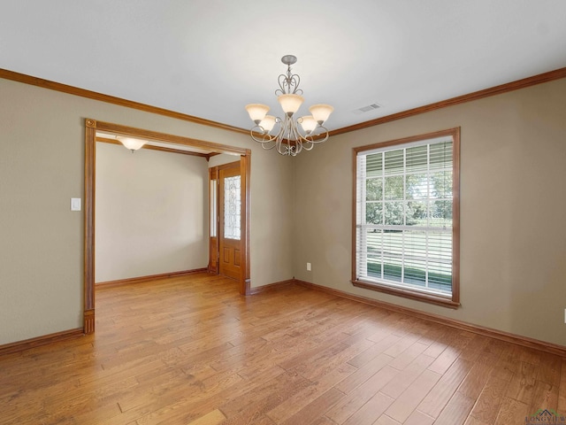 unfurnished room with light hardwood / wood-style floors, crown molding, and an inviting chandelier