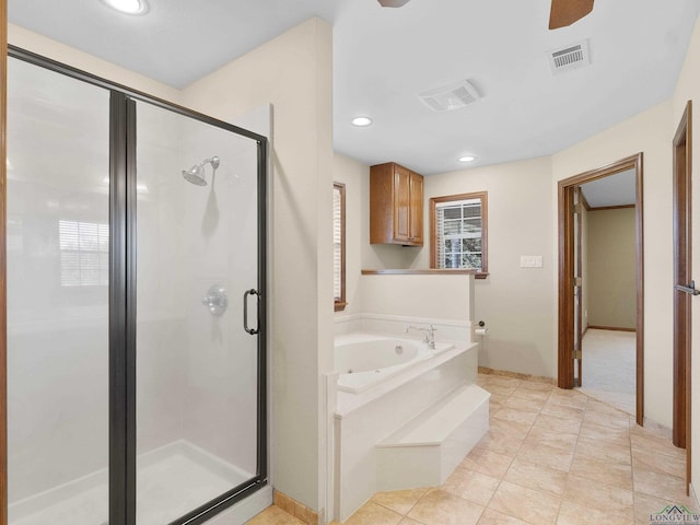 bathroom with tile patterned floors and separate shower and tub