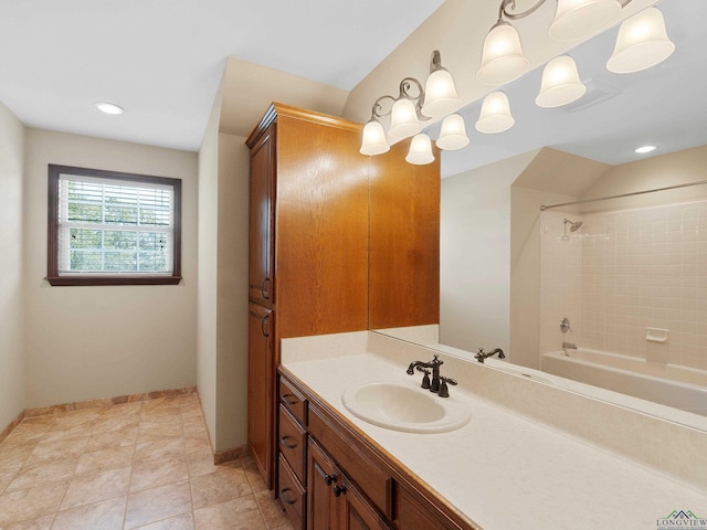 bathroom with vanity and tiled shower / bath combo