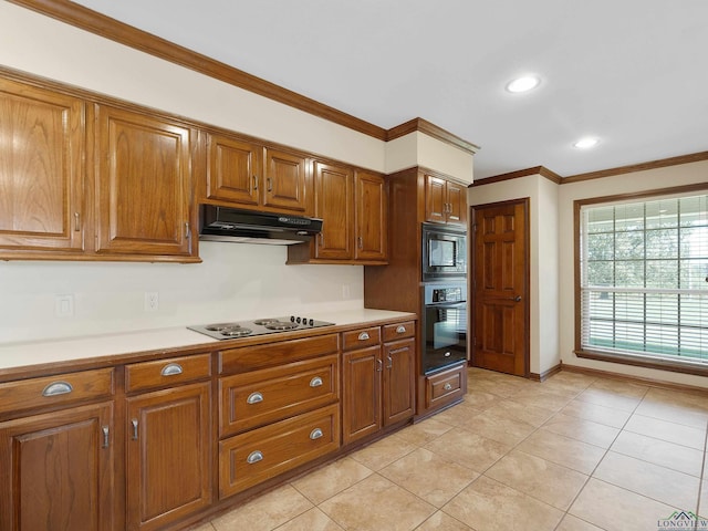 kitchen with black appliances, light tile patterned floors, and crown molding