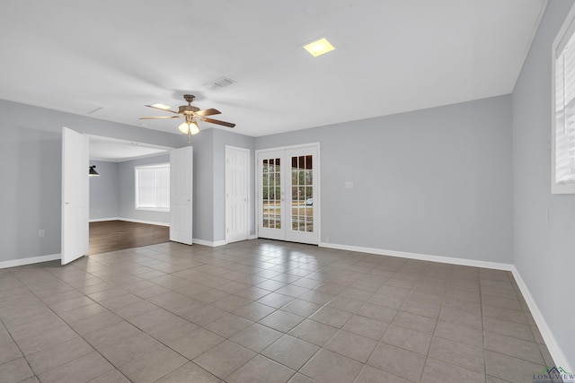 unfurnished room with french doors, ceiling fan, and light tile patterned flooring