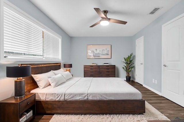 bedroom featuring ceiling fan and dark hardwood / wood-style flooring