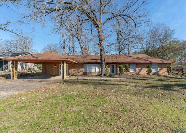 single story home with a carport and a front lawn