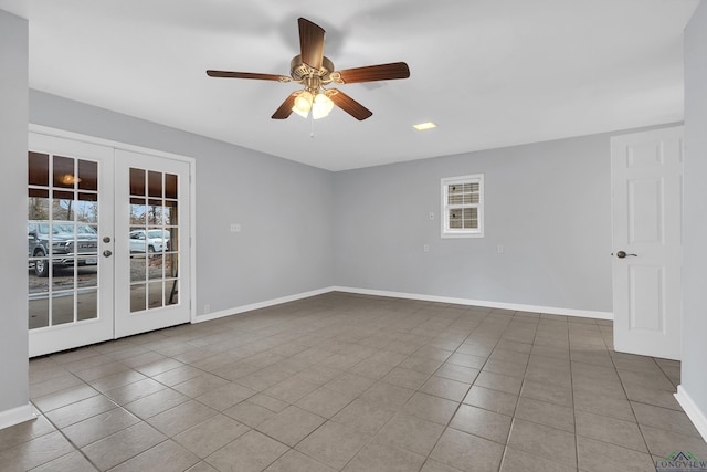 empty room featuring tile patterned floors, french doors, and ceiling fan