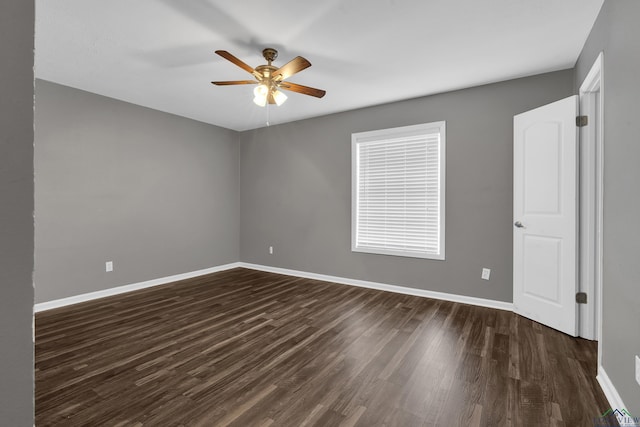 empty room with dark wood-type flooring and ceiling fan