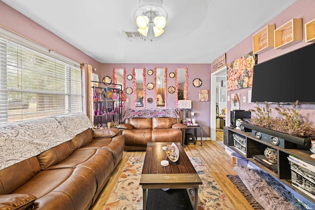 living room with ceiling fan and wood-type flooring