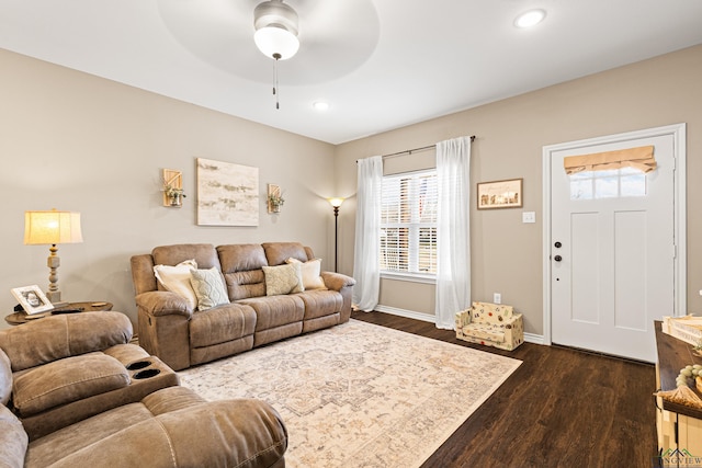 living room with dark hardwood / wood-style floors and ceiling fan