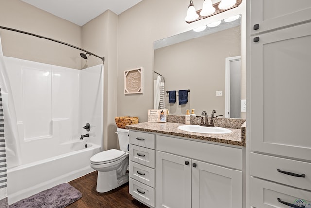 full bathroom featuring vanity, hardwood / wood-style floors, toilet, and shower / bathtub combination with curtain