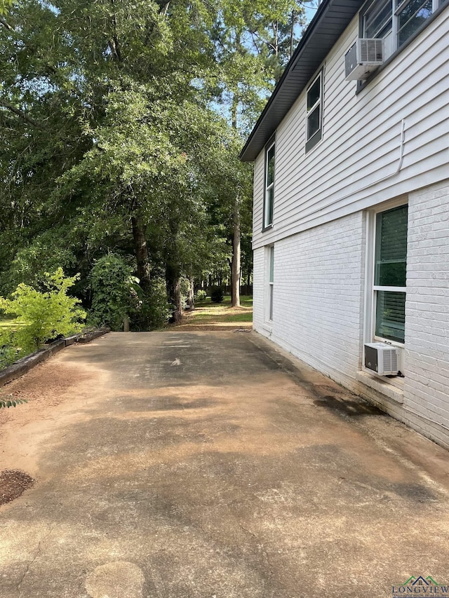 view of side of property featuring cooling unit