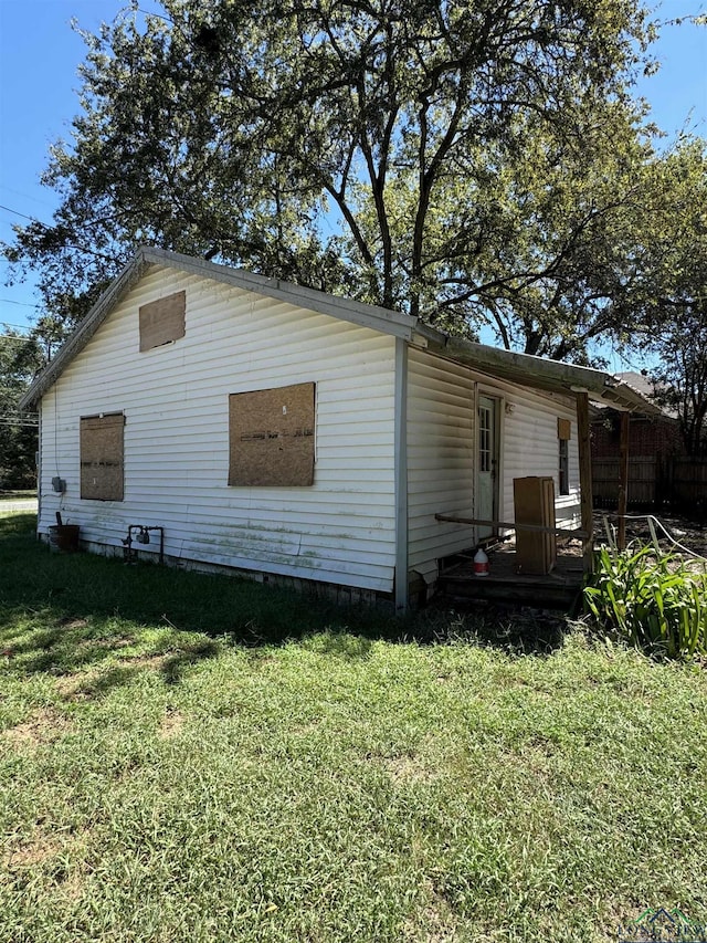 view of property exterior featuring a lawn