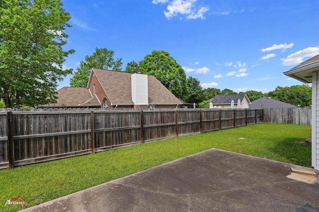 view of yard with a patio and a fenced backyard