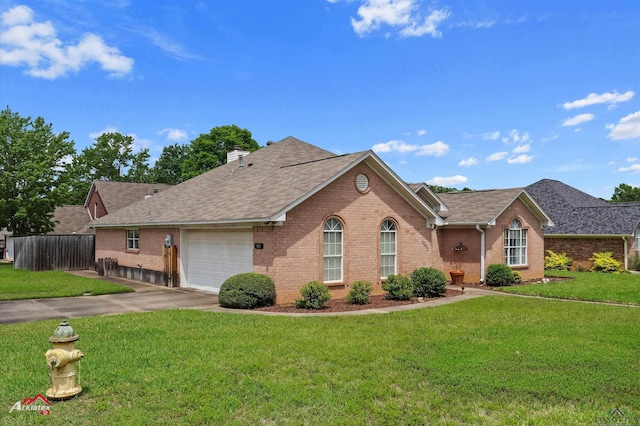 ranch-style house featuring an attached garage, concrete driveway, a front lawn, and brick siding