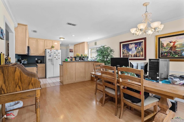 dining area with visible vents, ornamental molding, and a notable chandelier