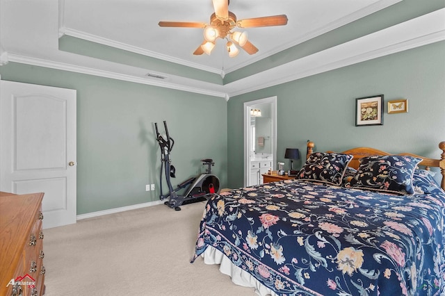 carpeted bedroom featuring ornamental molding, a tray ceiling, and visible vents