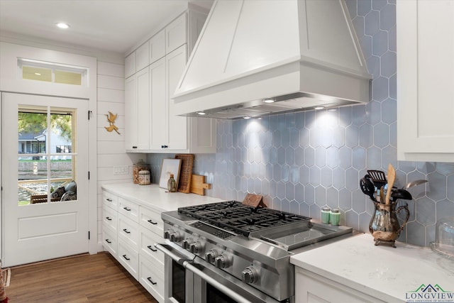 378 Cypress Creek Dr, Mount Vernon, TX 75457 - kitchen with high end range, custom exhaust hood, tasteful backsplash, white cabinetry, and dark wood finished floors