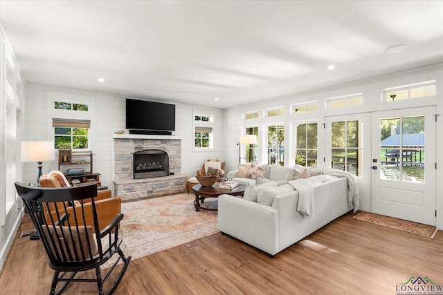 378 Cypress Creek Dr, Mount Vernon, TX 75457 - living area featuring light wood-type flooring, a stone fireplace, crown molding, and recessed lighting