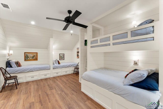 378 Cypress Creek Dr, Mount Vernon, TX 75457 - bedroom featuring vaulted ceiling, light wood finished floors, recessed lighting, wooden walls, and a ceiling fan