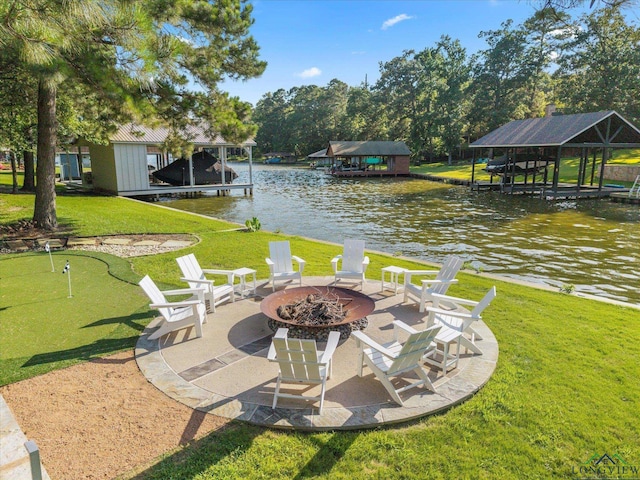 378 Cypress Creek Dr, Mount Vernon, TX 75457 - view of patio with a water view, a putting green, an outdoor fire pit, and a dock