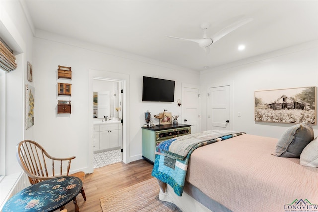 378 Cypress Creek Dr, Mount Vernon, TX 75457 - bedroom with light wood finished floors, connected bathroom, and ceiling fan